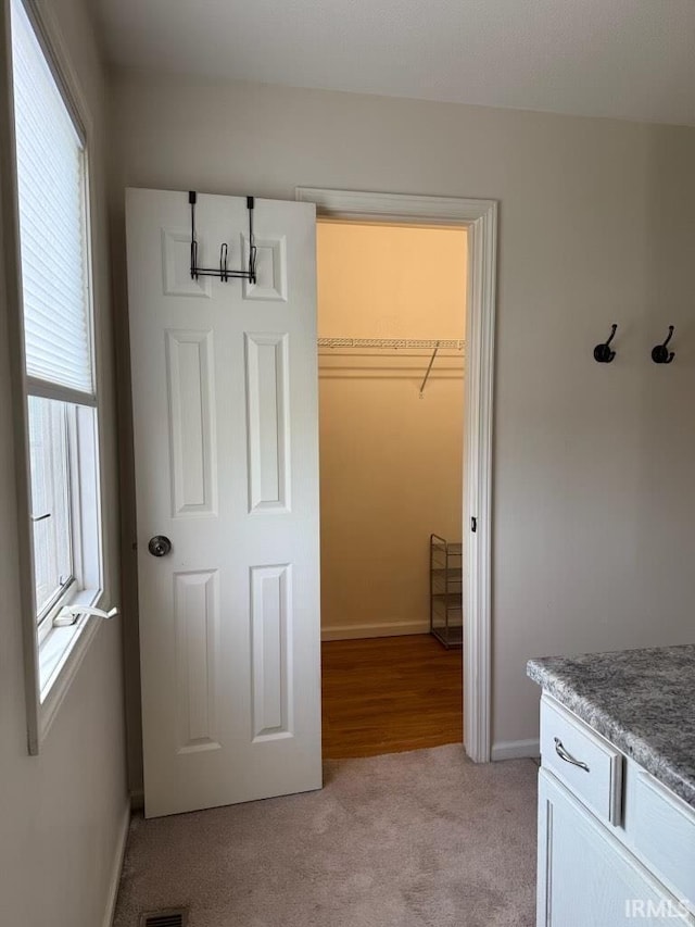 bathroom featuring baseboards and vanity