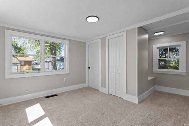 1508 E Hoffer St, Kokomo, IN 46902 - unfurnished bedroom with carpet floors, baseboards, and a closet