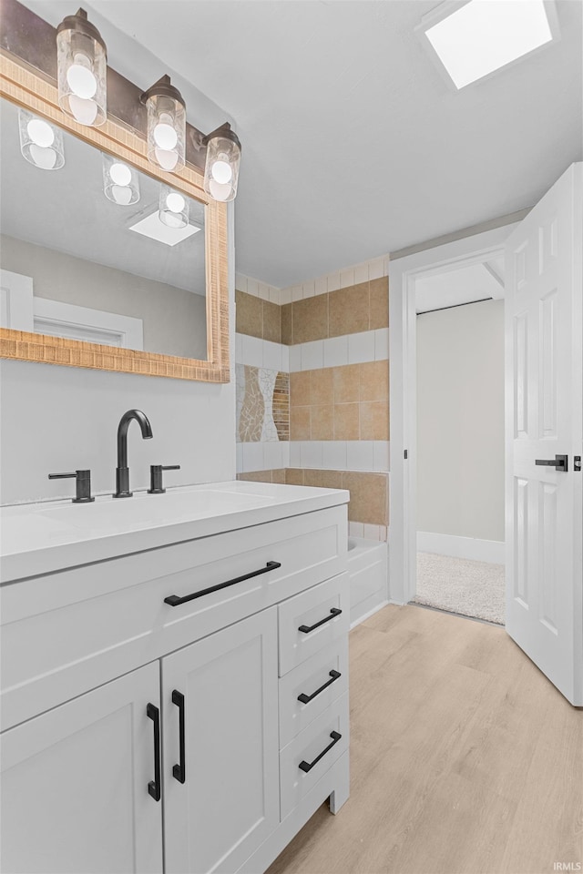 1508 E Hoffer St, Kokomo, IN 46902 - full bathroom with wood finished floors, vanity, and a shower