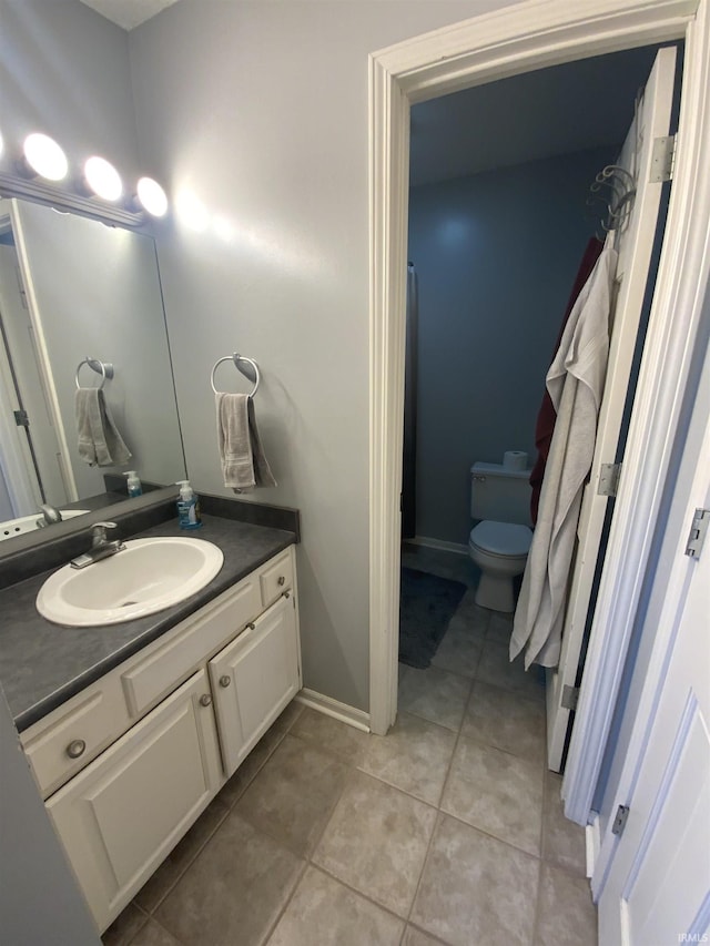 1108 Silver Springs Ct, Fort Wayne, IN 46825 - bathroom with vanity, tile patterned flooring, toilet, and baseboards