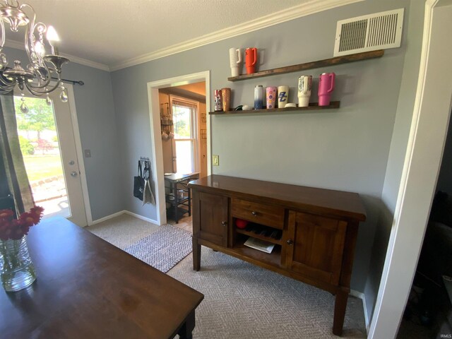 1108 Silver Springs Ct, Fort Wayne, IN 46825 - foyer entrance with a chandelier, carpet floors, plenty of natural light, ornamental molding, and baseboards