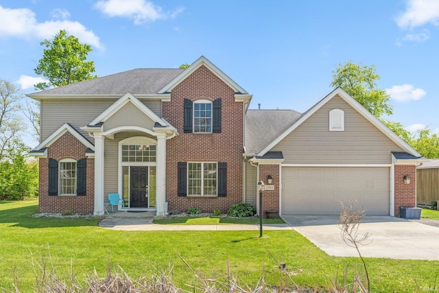 2904 Union Chapel Rd, Fort Wayne, IN 46845 - traditional-style home featuring concrete driveway, a garage, a front lawn, and brick siding