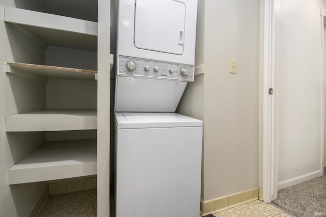 53455 Stoneridge St Unit C, South Bend, IN 46637 - washroom featuring estacked washer and dryer and baseboards