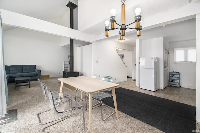 53455 Stoneridge St Unit C, South Bend, IN 46637 - dining space with a chandelier, a high ceiling, and baseboards