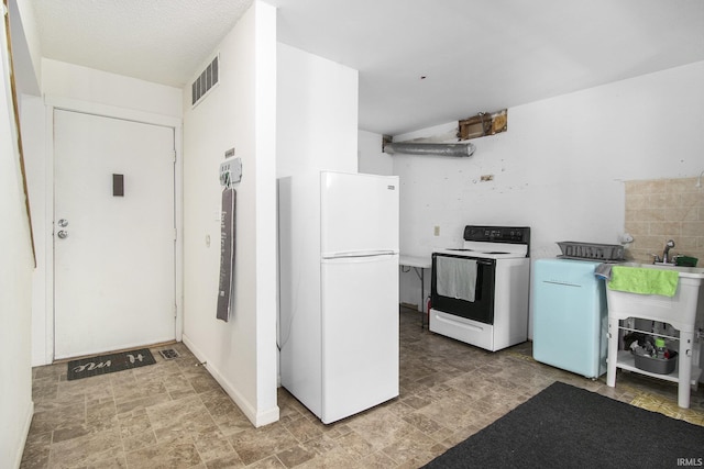 53455 Stoneridge St Unit C, South Bend, IN 46637 - kitchen with white appliances, washer / clothes dryer, and stone finish floors