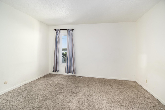53455 Stoneridge St Unit C, South Bend, IN 46637 - spare room featuring carpet, baseboards, and a textured ceiling