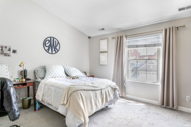 bedroom featuring carpet flooring, lofted ceiling, and baseboards