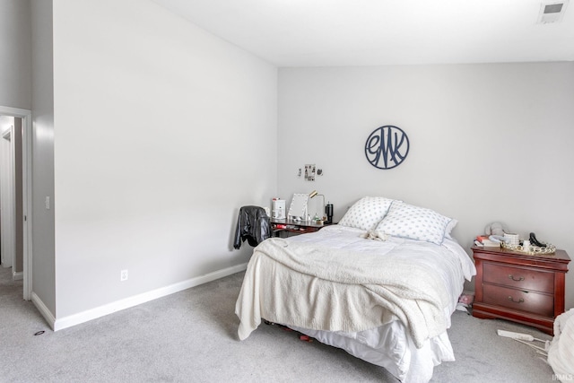 carpeted bedroom featuring baseboards