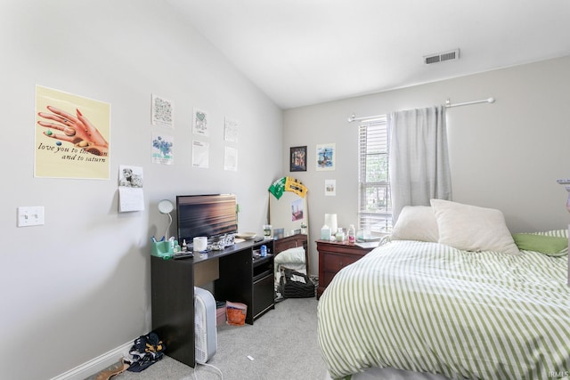 bedroom with light colored carpet, a desk, and baseboards