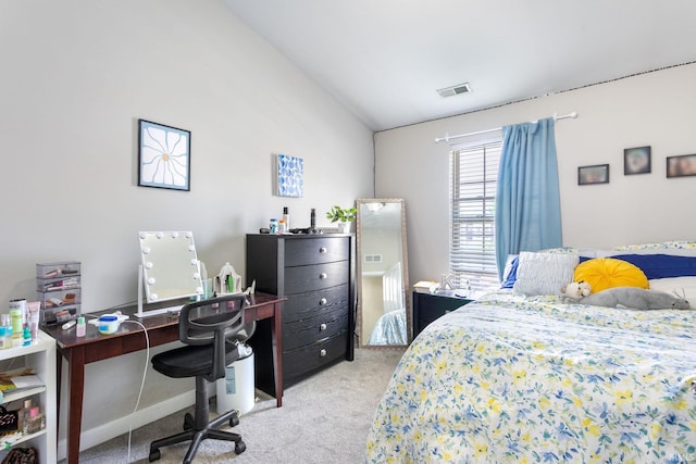 bedroom with carpet flooring, lofted ceiling, and a desk