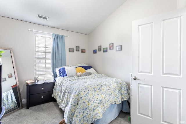 bedroom featuring carpet flooring and vaulted ceiling