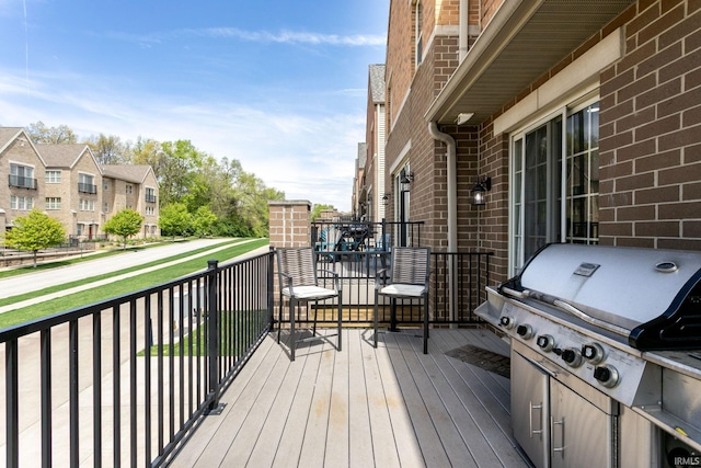 wooden deck with grilling area