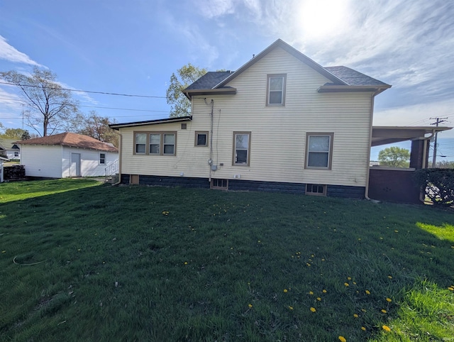 back of property with a lawn