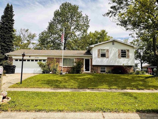 2796 Alexandria Ct, Lafayette, IN 47909 - split level home featuring an attached garage, a front lawn, driveway, and brick siding
