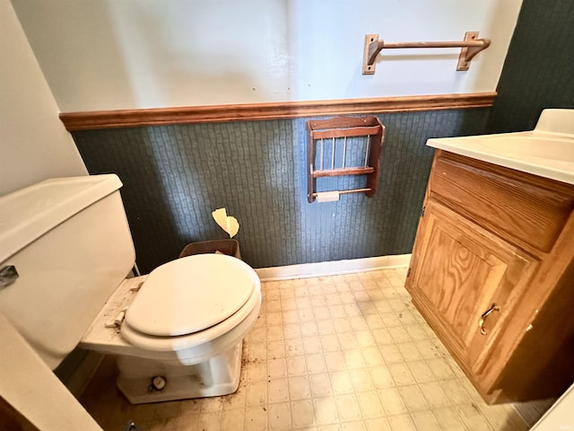 2796 Alexandria Ct, Lafayette, IN 47909 - half bathroom with a wainscoted wall, toilet, tile patterned floors, and vanity