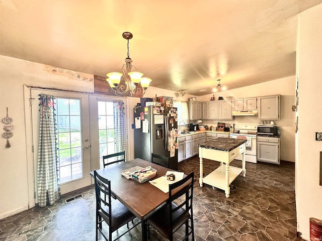 2796 Alexandria Ct, Lafayette, IN 47909 - dining room featuring a chandelier and stone floors