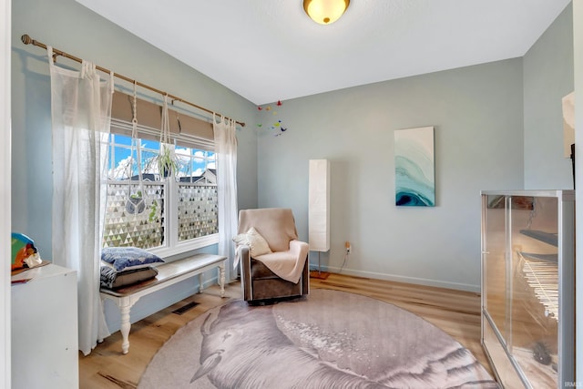 sitting room featuring wood finished floors and baseboards