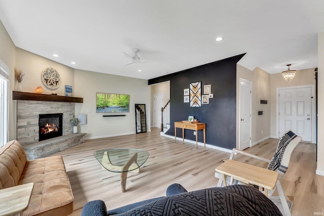 living area featuring light wood-style floors, stairway, recessed lighting, a chandelier, and baseboards