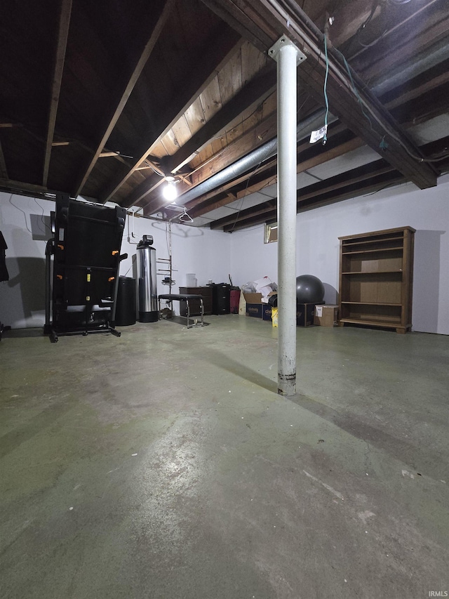304 N Main St, South Whitley, IN 46787 - unfinished basement featuring heating unit and water heater