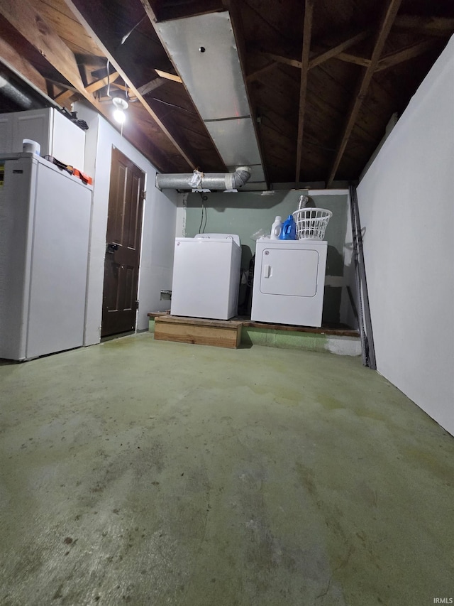 304 N Main St, South Whitley, IN 46787 - below grade area with washer and clothes dryer and refrigerator