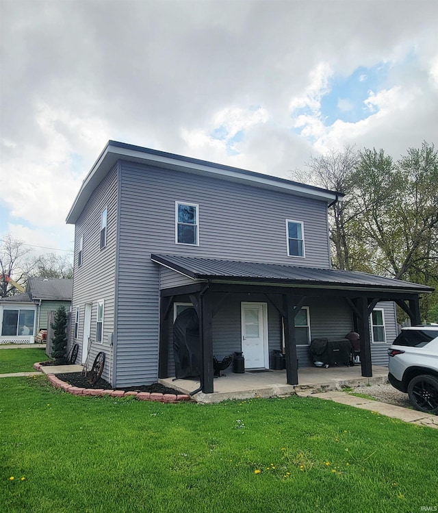 109 N Martin St, Ligonier, IN 46767 - view of front of home featuring a front yard and a patio area