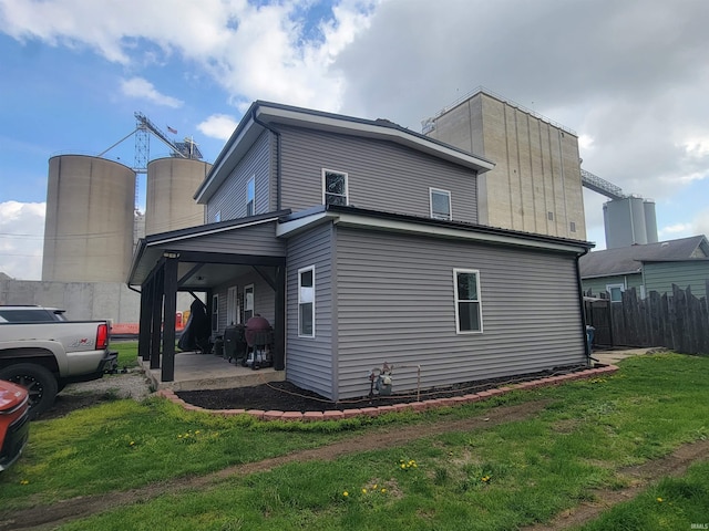 109 N Martin St, Ligonier, IN 46767 - view of side of home featuring a patio area
