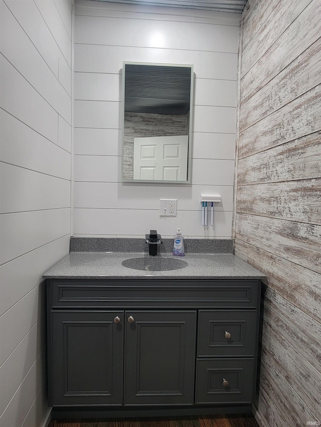 109 N Martin St, Ligonier, IN 46767 - bathroom with wooden walls and vanity