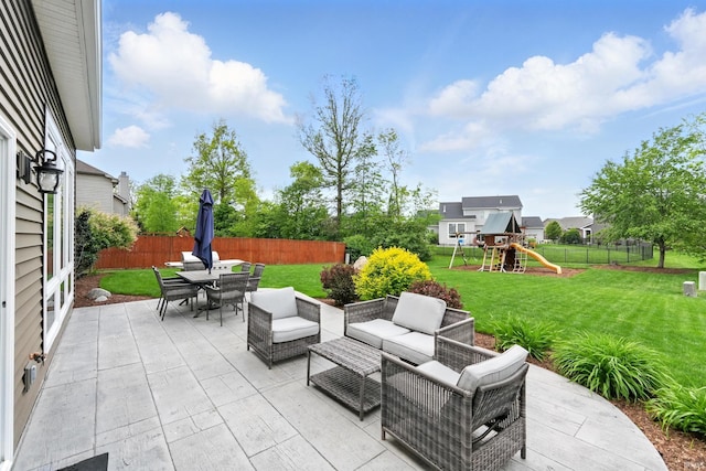 view of patio / terrace with outdoor dining area, an outdoor hangout area, and a playground