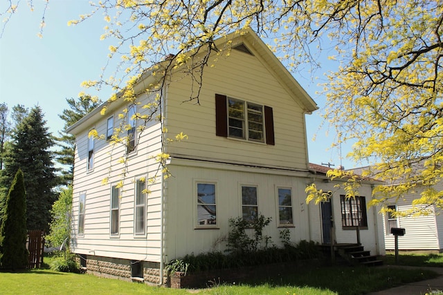 404 S Peters St, Garrett, IN 46738 - view of home's exterior featuring a yard