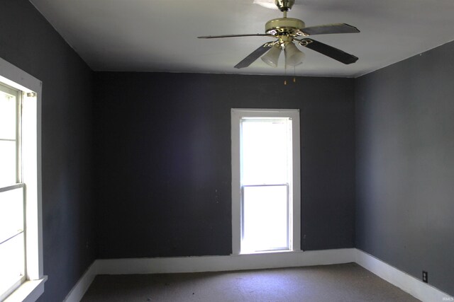 404 S Peters St, Garrett, IN 46738 - spare room featuring ceiling fan and baseboards