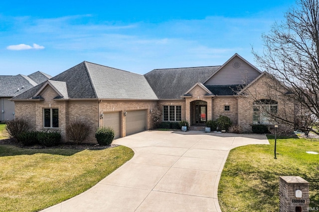 51025 Bellcrest Cir, Granger, IN 46530 - view of front facade with brick siding, an attached garage, and a shingled roof