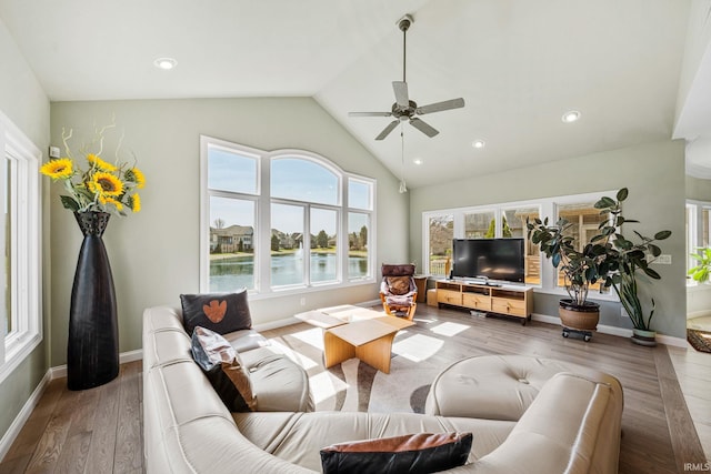 51025 Bellcrest Cir, Granger, IN 46530 - living room featuring a ceiling fan, vaulted ceiling, wood finished floors, baseboards, and recessed lighting