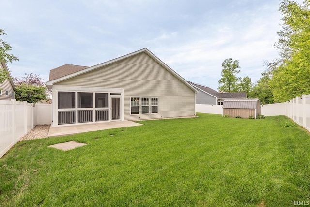 back of property featuring a storage shed, an outbuilding, and a patio area