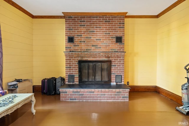 living room with crown molding, a brick fireplace, and wooden walls