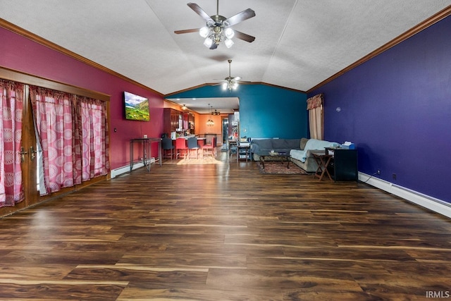 dining room featuring a ceiling fan, ornamental molding, a baseboard heating unit, lofted ceiling, and wood finished floors