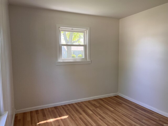 2211 E 19th St, Muncie, IN 47302 - spare room with light wood-style flooring and baseboards