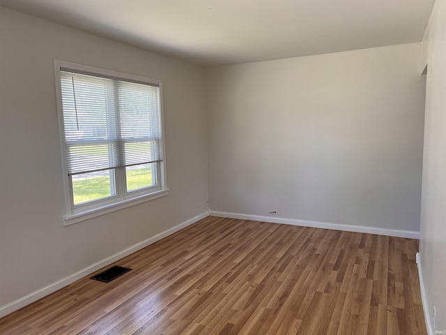 2211 E 19th St, Muncie, IN 47302 - spare room featuring light wood-type flooring and baseboards