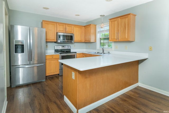 1017 S Carleton Ct, Bloomington, IN 47401 - kitchen featuring stainless steel appliances, a sink, dark wood-style flooring, a peninsula, and light countertops