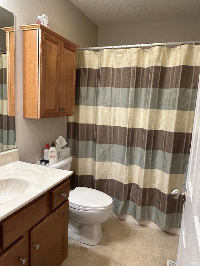 bathroom with vanity, a textured ceiling, toilet, and a shower with curtain