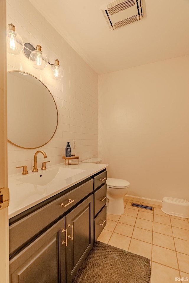 119 Highland Dr, Wabash, IN 46992 - bathroom featuring tile patterned flooring, vanity, toilet, and backsplash