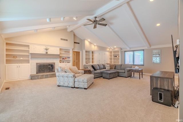 119 Highland Dr, Wabash, IN 46992 - carpeted living area featuring baseboards, a fireplace, a ceiling fan, recessed lighting, and built in shelves
