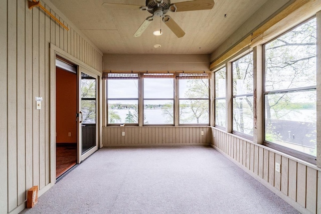 20 Lane 650c Snow Lk, Fremont, IN 46737 - unfurnished sunroom featuring ceiling fan, carpet, plenty of natural light, and wooden walls