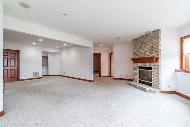 20 Lane 650c Snow Lk, Fremont, IN 46737 - unfurnished living room with light colored carpet, a fireplace, baseboards, and recessed lighting