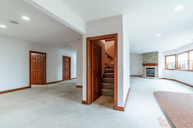 20 Lane 650c Snow Lk, Fremont, IN 46737 - stairs with carpet floors, a fireplace, baseboards, and recessed lighting