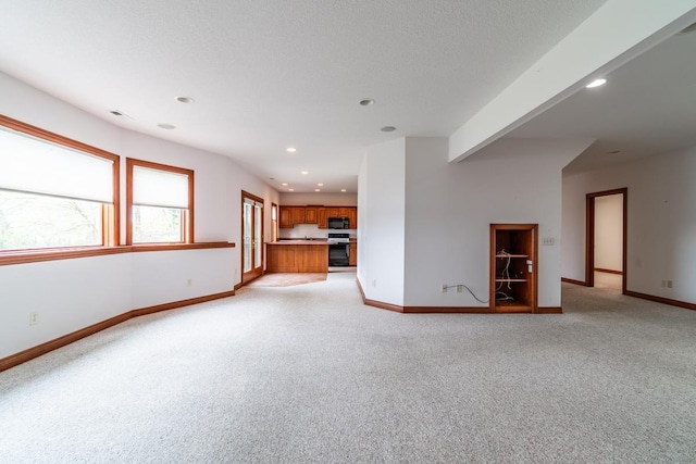 20 Lane 650c Snow Lk, Fremont, IN 46737 - unfurnished living room featuring light carpet, baseboards, and recessed lighting