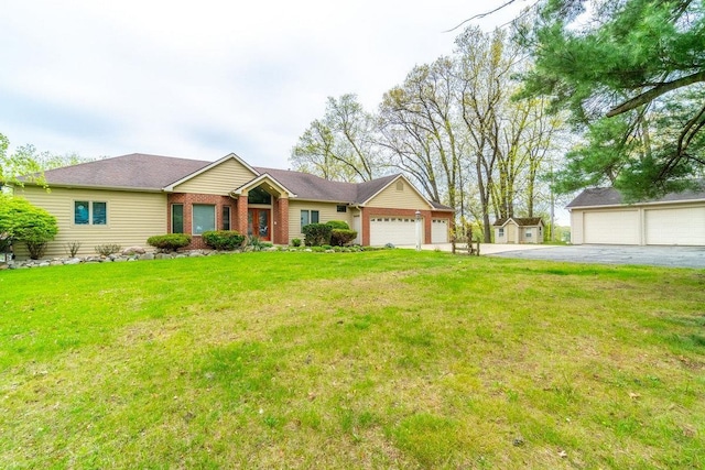 20 Lane 650c Snow Lk, Fremont, IN 46737 - ranch-style house featuring a front lawn, brick siding, a garage, and an outbuilding