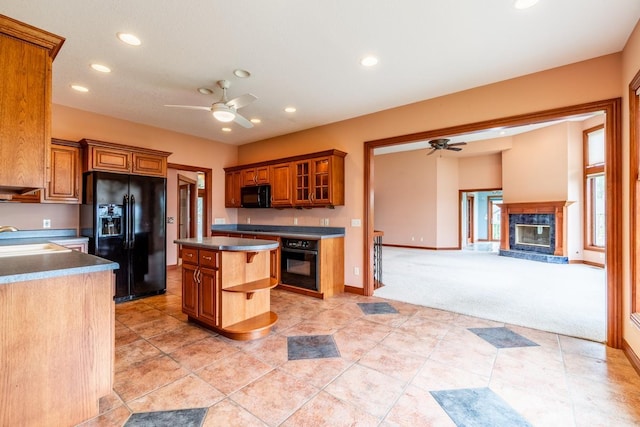 20 Lane 650c Snow Lk, Fremont, IN 46737 - kitchen with black appliances, ceiling fan, brown cabinetry, a fireplace, and recessed lighting