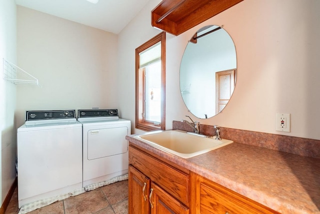 20 Lane 650c Snow Lk, Fremont, IN 46737 - clothes washing area with separate washer and dryer, a sink, and light tile patterned floors