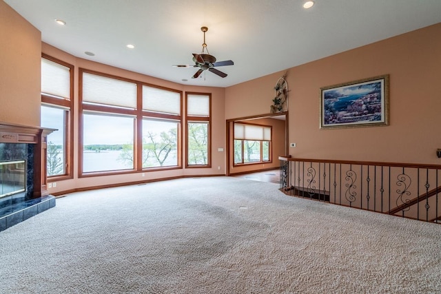 20 Lane 650c Snow Lk, Fremont, IN 46737 - unfurnished living room with carpet floors, a ceiling fan, recessed lighting, a premium fireplace, and baseboards