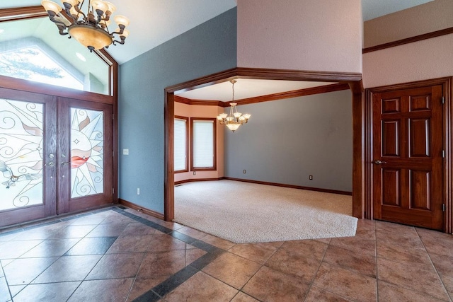 20 Lane 650c Snow Lk, Fremont, IN 46737 - foyer featuring a chandelier, french doors, lofted ceiling, baseboards, and ornamental molding
